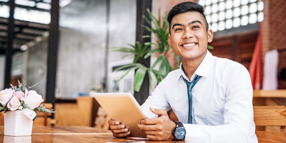 Happy employee learning about his new job at American Property Management in Bellevue, Washington