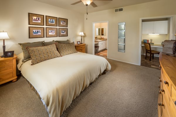 Model bedroom with a ceiling fan at Stone Oaks in Chandler, Arizona