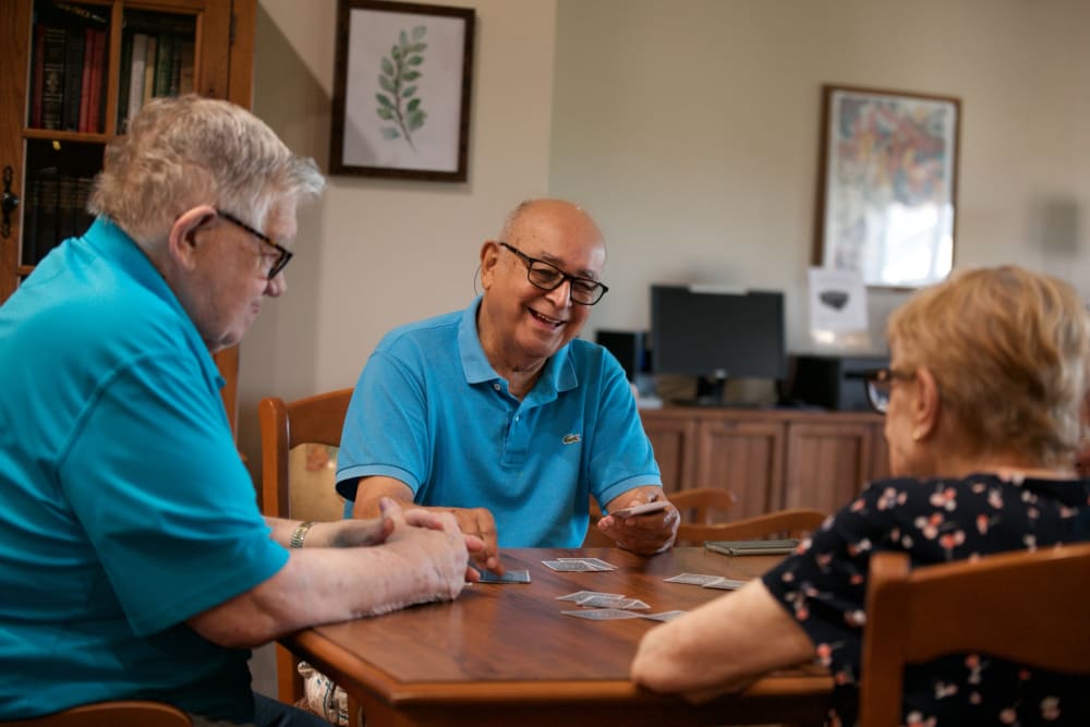 Caretaker assisting a resident out of bed at Traditions of Hanover in Bethlehem, Pennsylvania