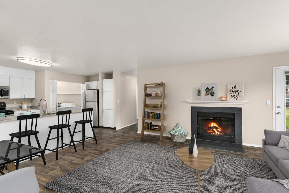 Spacious living room with carpet flooring at Carriage Park Apartments in Vancouver. WA