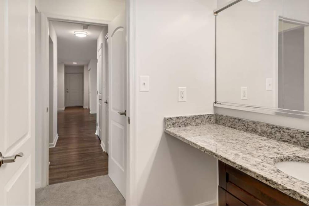 Sink and hallway at Annen Woods Apartments in Pikesville, Maryland