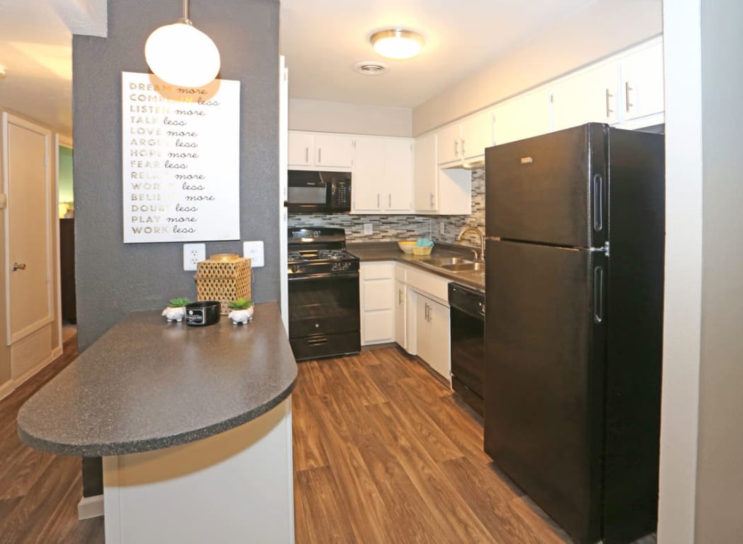 Kitchen features granite countertops at Casa Tierra in Albuquerque, New Mexico
