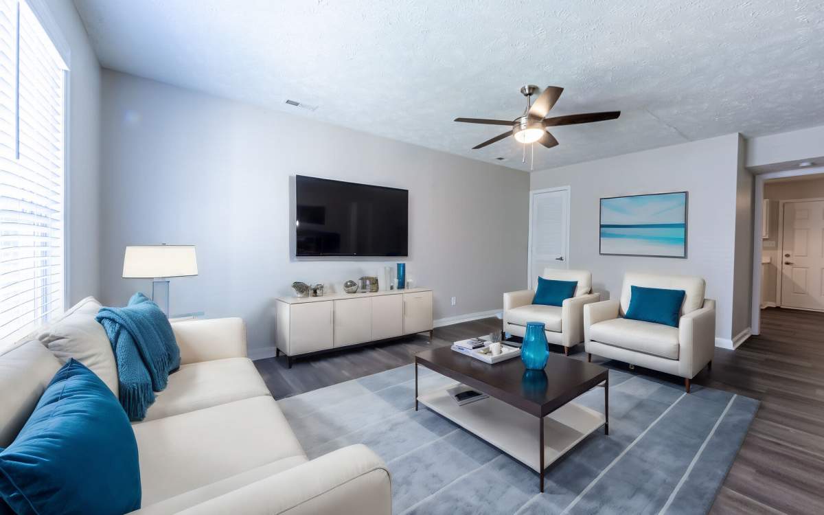 Well-furnished living room of an apartment at Cape Fear Townhomes in Fayetteville, North Carolina