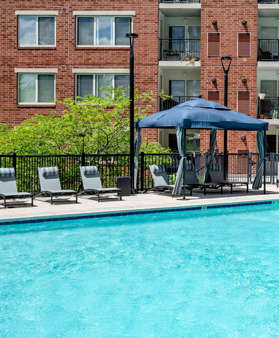 Chaise lounge chairs surrounding the pool at Sofi at 50 Forest in Stamford, Connecticut