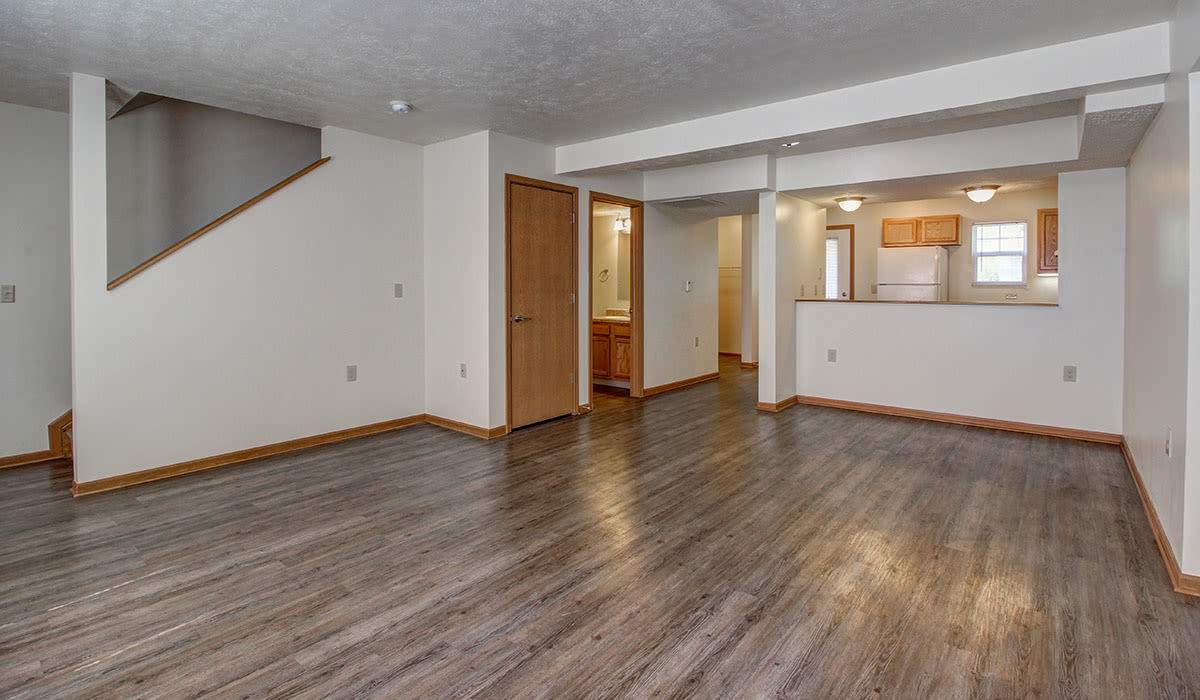 Bright living room with access to kitchen at Sterling Greene in Fayetteville, Tennessee