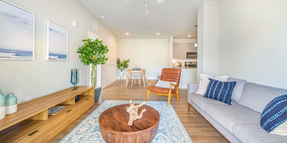 Spacious living room and kitchen area in a model home at The Mason in Ladson, South Carolina