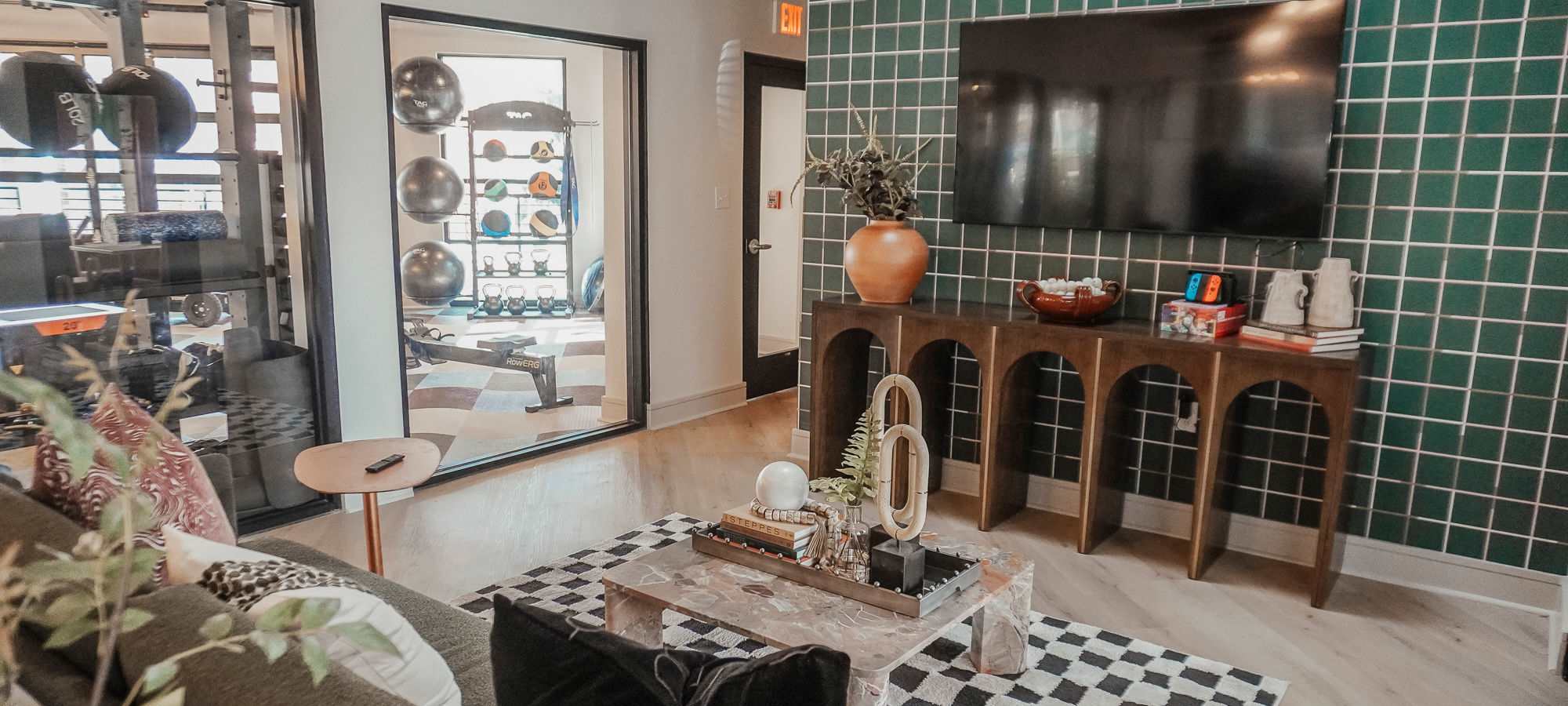 Resident lounge in the new clubhouse at The Quarters Starkville in Starkville, Mississippi