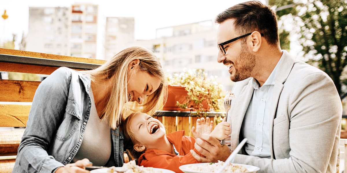 Resident family eating dinner near Marquis at Legacy in Plano, Texas