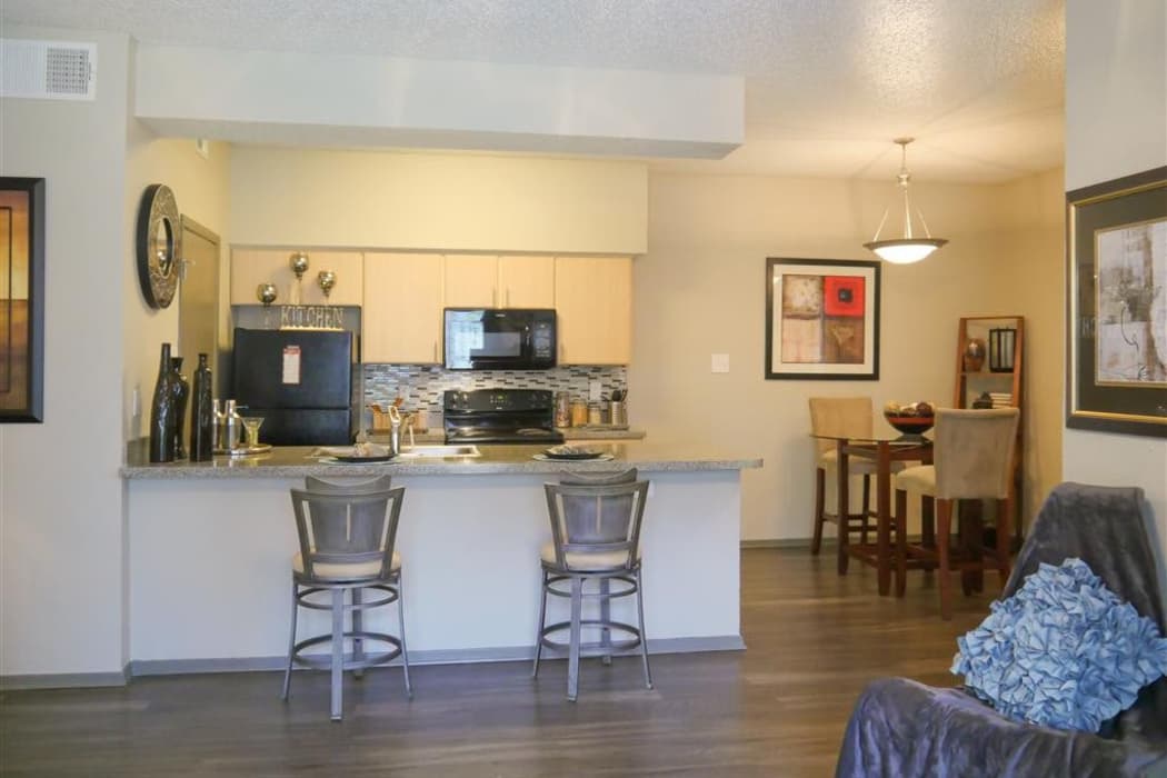 Beautiful kitchen and dining area view of model home at Veridian Place in Dallas, Texas