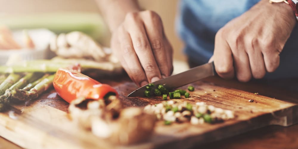 Resident cooking at Aurora Reno in Reno, Nevada