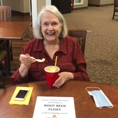 Resident with a root beer float at an activity held by Landings of Minnetonka in Minnetonka, Minnesota