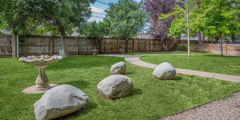 Landscape with ample amount of plantation at Wellshire Apartments in Denver, Colorado