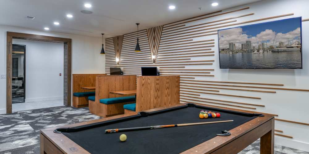 Common game room with large pool table at Soba Apartments in Jacksonville, Florida