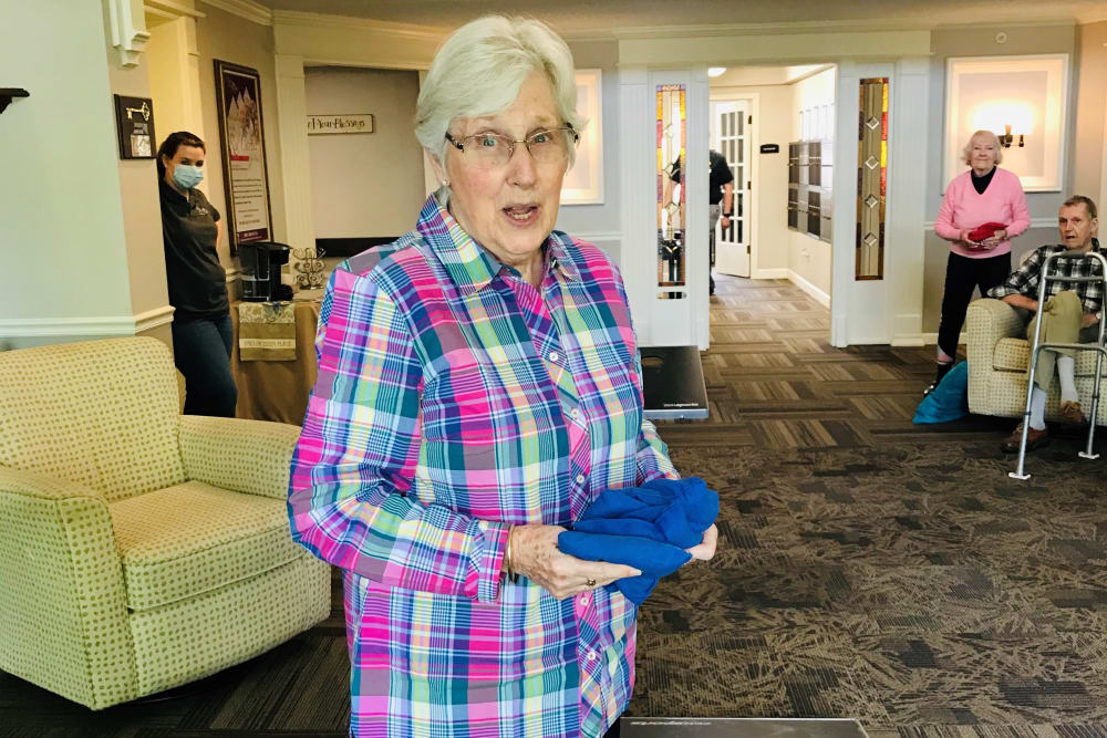 Resident playing a game at Brown Deer Place in Coralville, Iowa