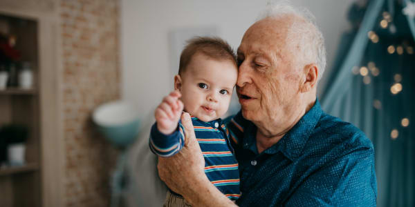 Resident holding his grandchild at Ingleside Communities in Mount Horeb, Wisconsin