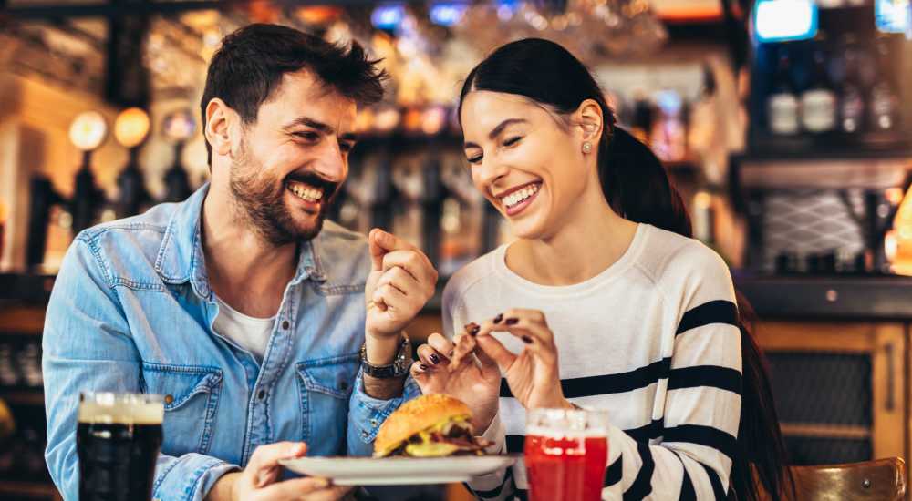 A resident meets friends for a bite to eat near Newport Avenue Apartments in Rumford, Rhode Island