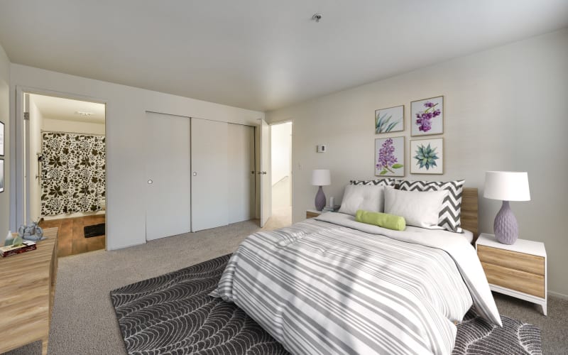 Spacious master bedroom with plush carpeting at Renaissance at 29th Apartments in Vancouver, Washington