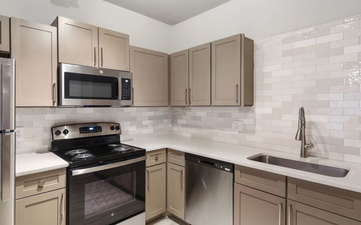 Kitchen with beige color cabinet  at Easton in San Antonio, Texas