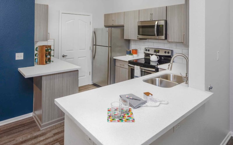 White cabinets in a kitchen at The Grove at Orenco Station in Hillsboro, Oregon