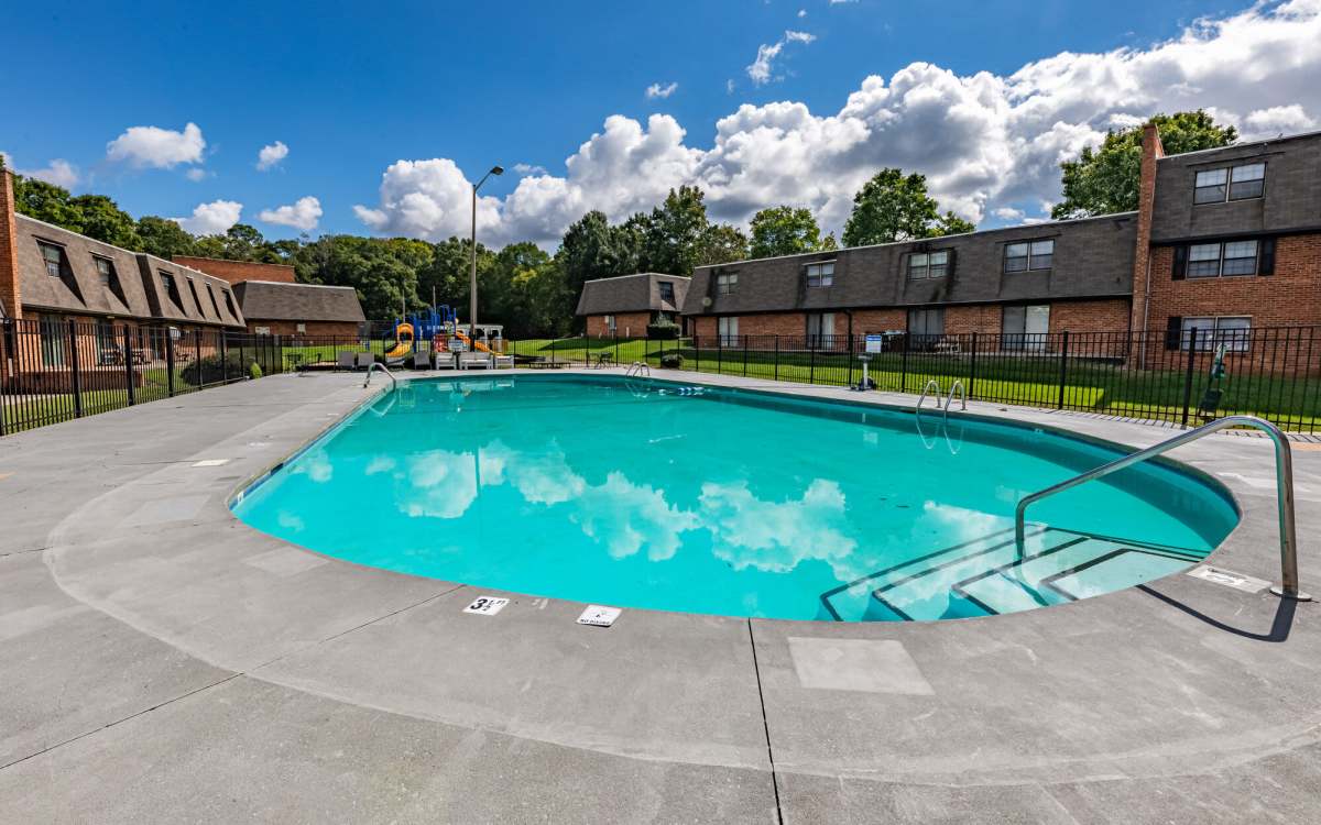 Resort-style swimming pool at Huffman Mill Townhomes in Burlington, North Carolina