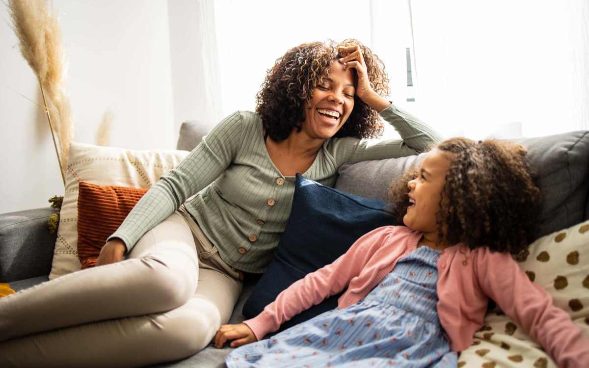 Resident petting his cat in their pet-friendly home at Woodland Manor in Farmington, New York 