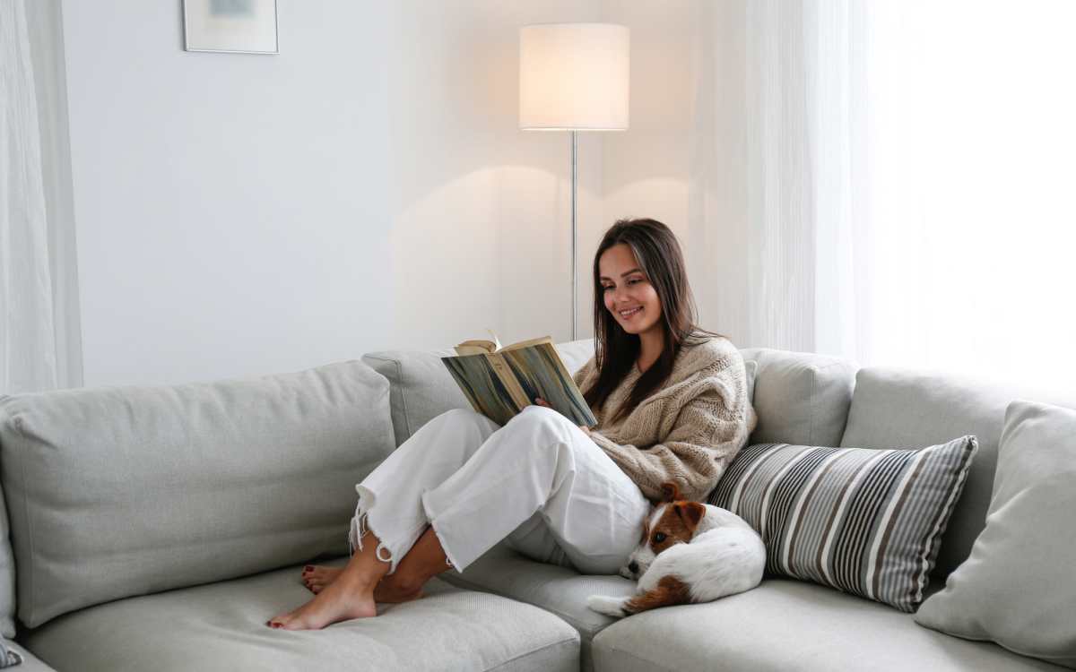 Resident in her apartment with her pet dog at El Jardin Apartments in Hollywood, Florida
