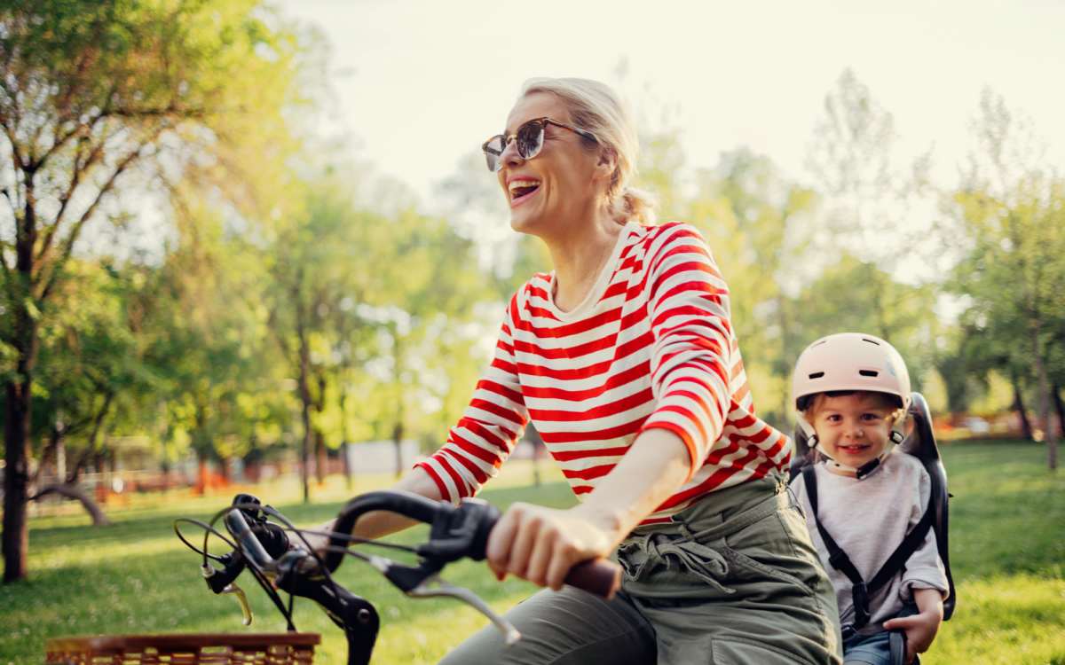 Resident riding bike with her daughter near Fairview Crossing in Scottsburg, Indiana