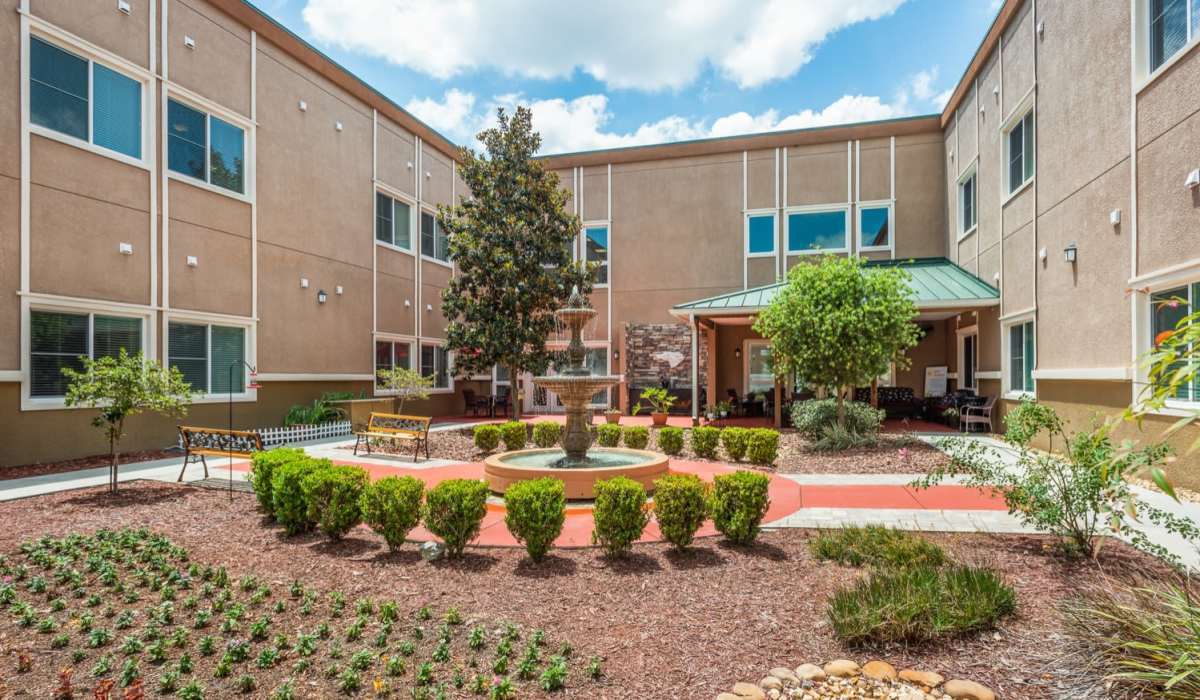 Outdoor lounge are awith seating and fountain at Grand Villa of Ocala in Ocala, Florida