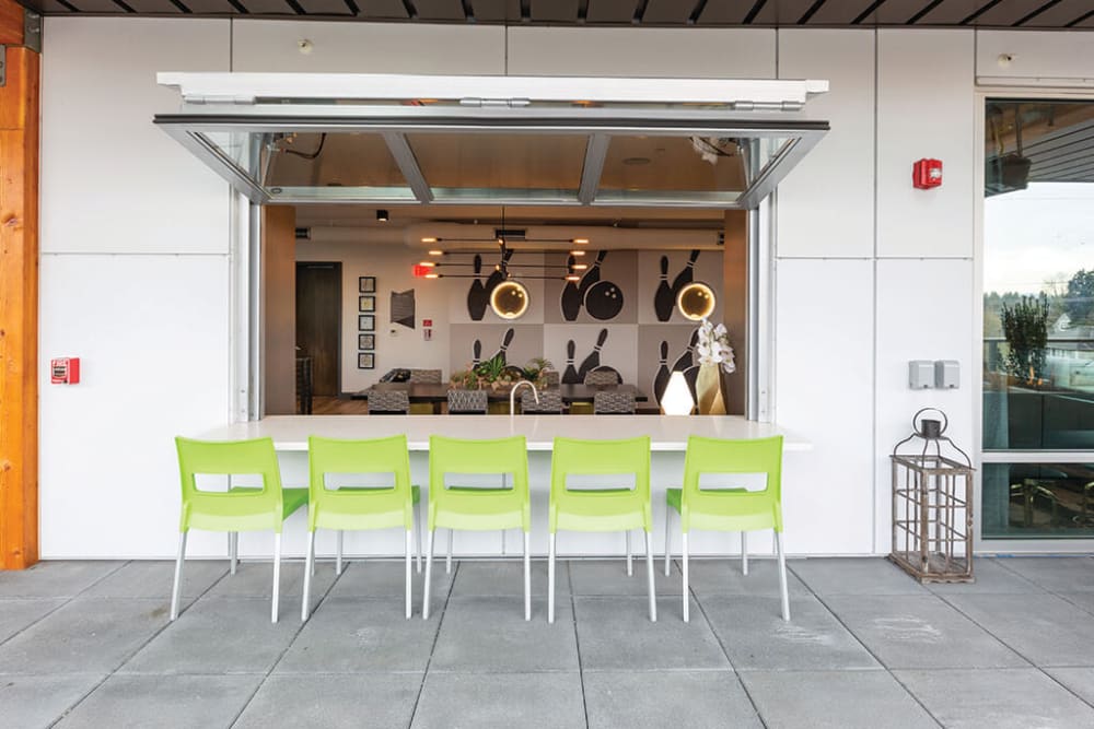 Bar seating outside at the rooftop lounge at ArLo Apartments in Portland, Oregon