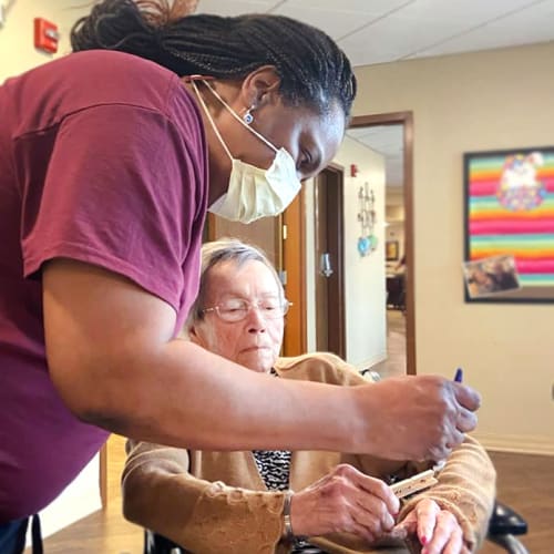 A team member and resident at The Oxford Grand Assisted Living & Memory Care in Kansas City, Missouri