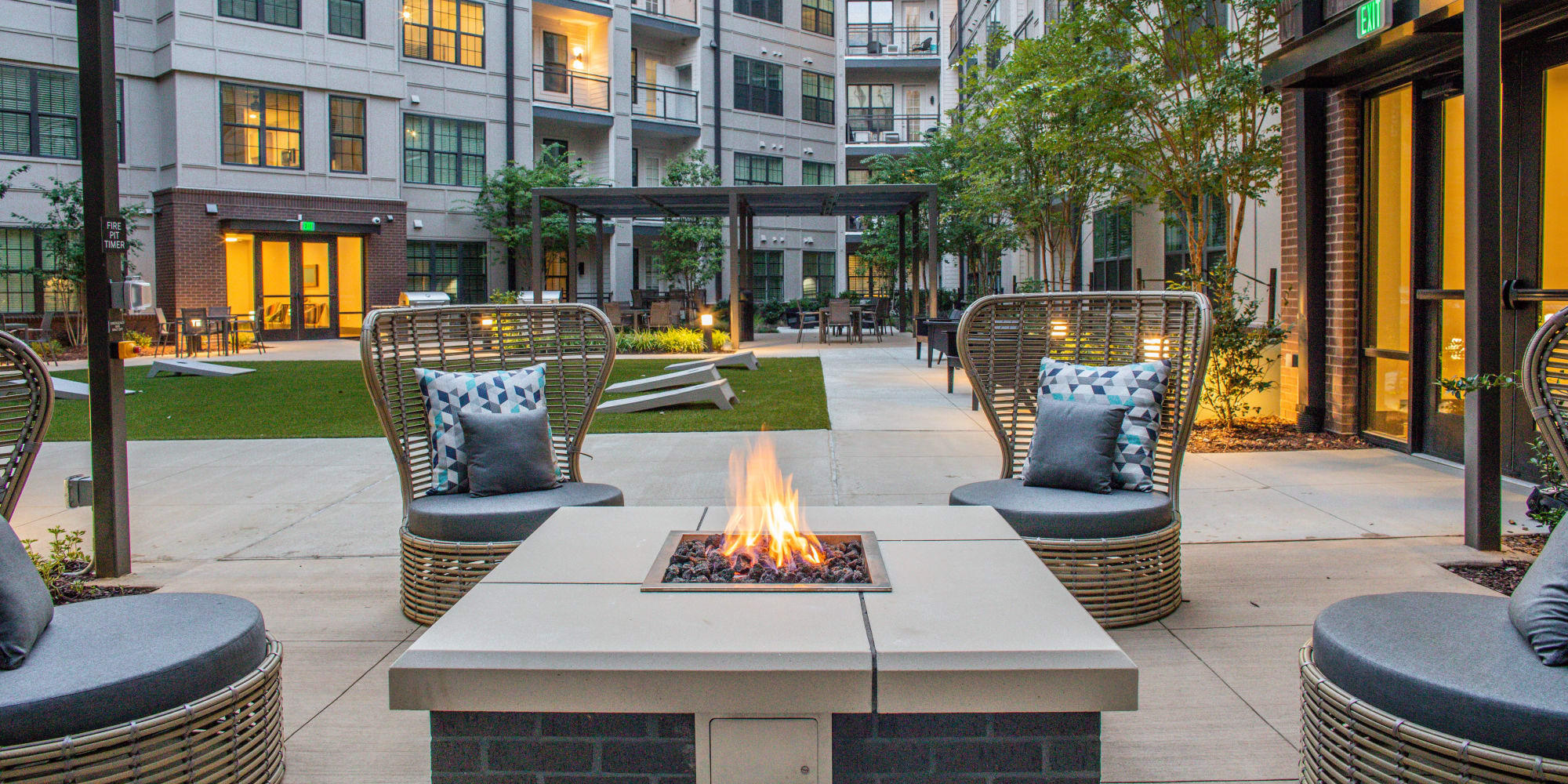 A community firepit with outdoor seating at Allegiant-Carter Management in Tampa, Florida