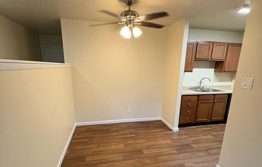 Unfurnished open concept dining area and kitchen at Edgewood Group Apartments in Merrillville, Indiana