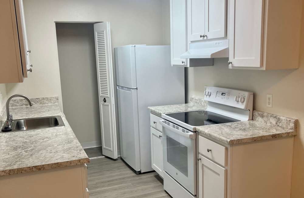 Kitchen with wood-style floors at  Forest Park in Chico, California