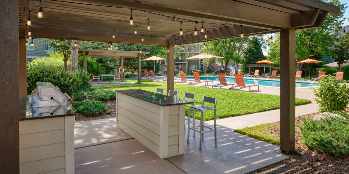 Poolside BBQ Area at Legend Oaks Apartments in Aurora, Colorado