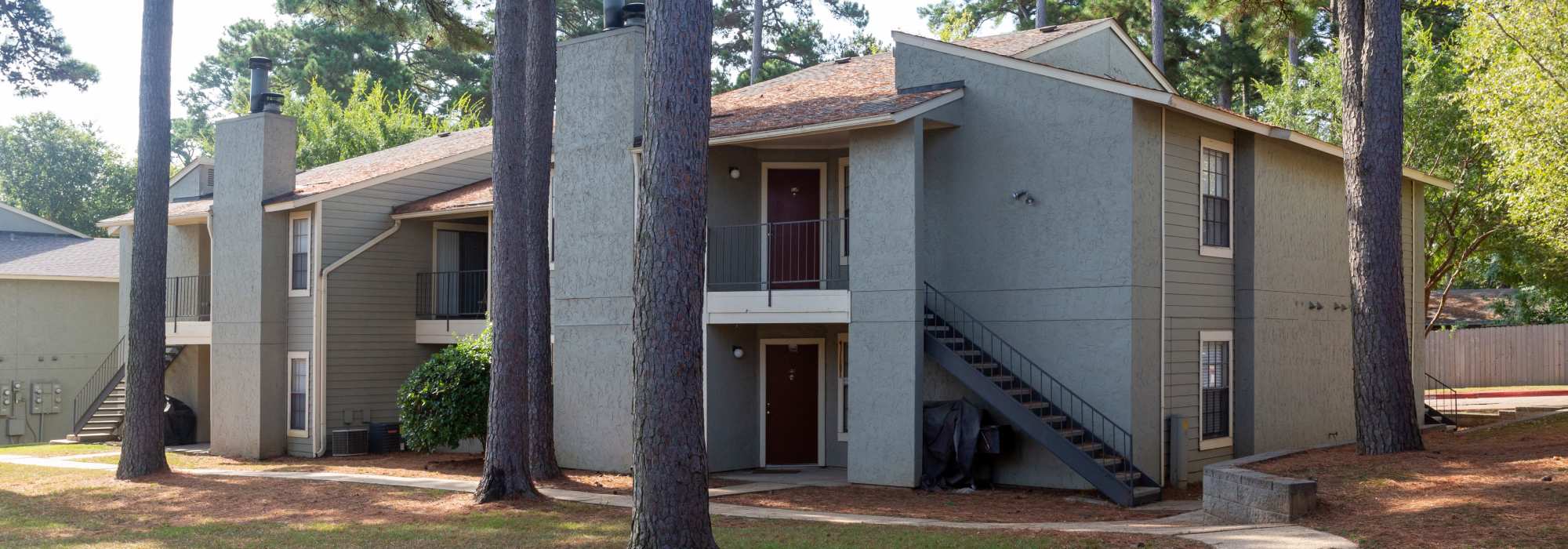 An apartment featuring two-story buildings with staircase at Southwood Village in Shreveport, Louisiana