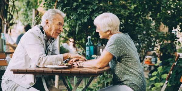 Resident couple sitting at a coffee shop near a WISH community