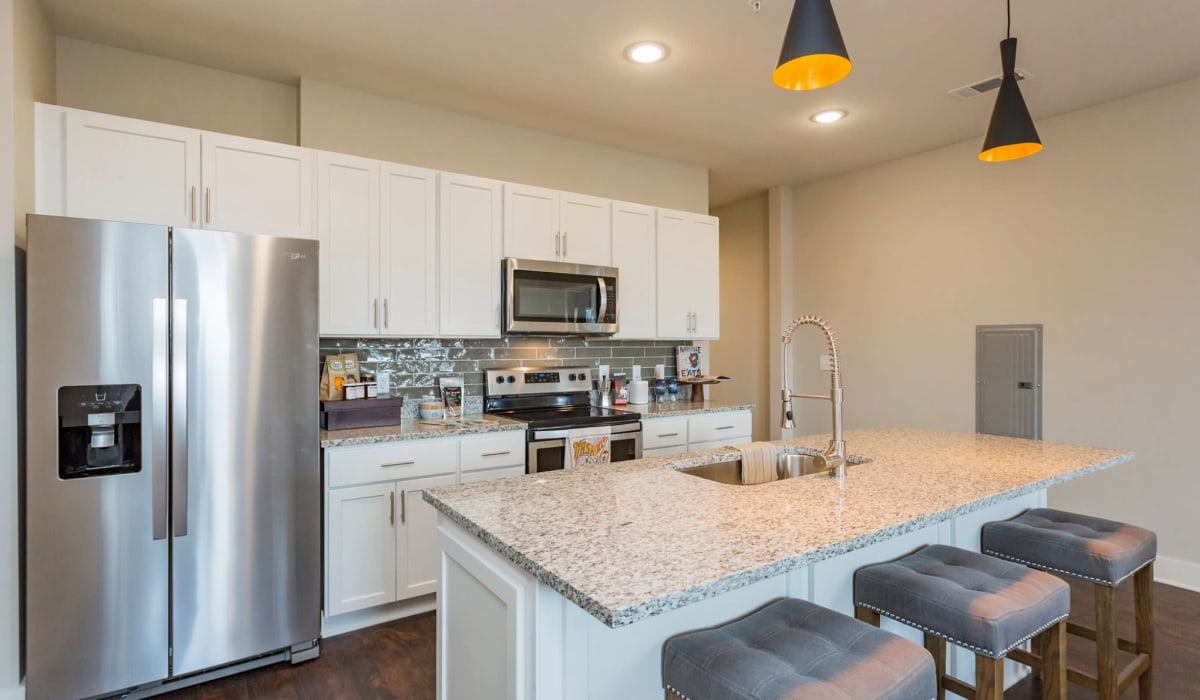 Huge kitchen island with bar stool seating at Rivertop Apartments in Nashville, Tennessee