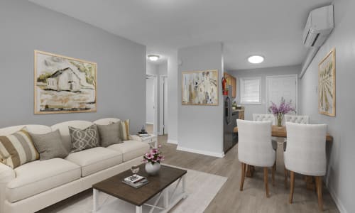 Hardwood flooring and furniture in a model apartment living room at Alpine Apartment Homes in Columbus, Georgia