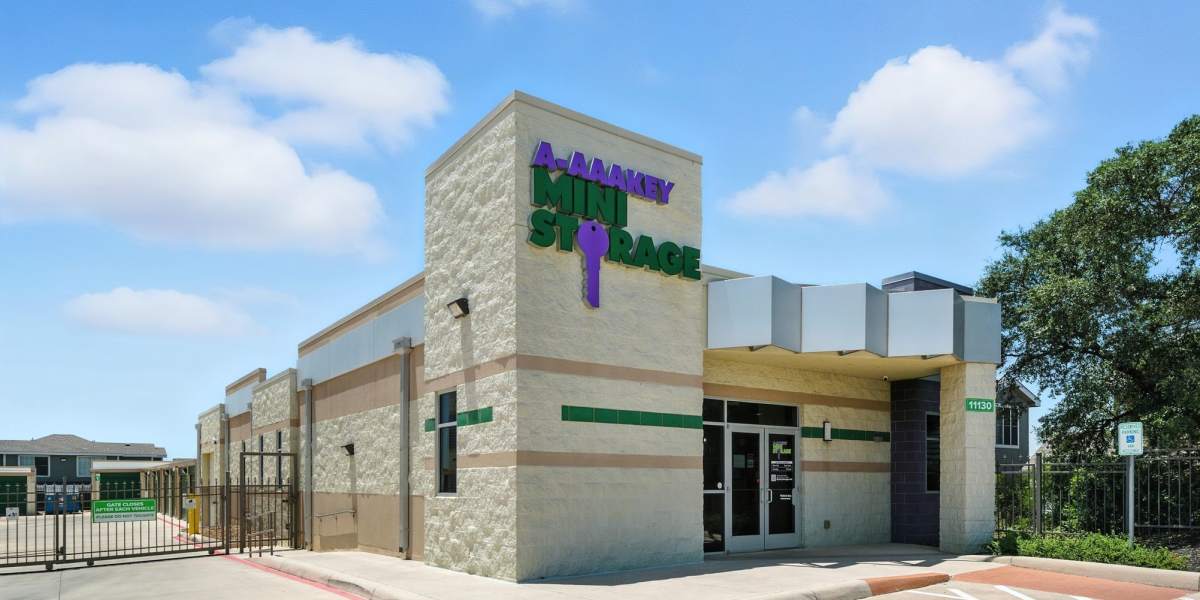 A customer locking their unit at Storage Hub - Military in San Antonio, Texas