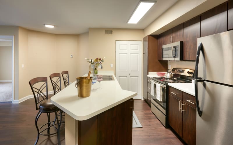 Espresso cabinets in the kitchen overlooking the dining room at Villas at Homestead Apartments in Englewood, Colorado