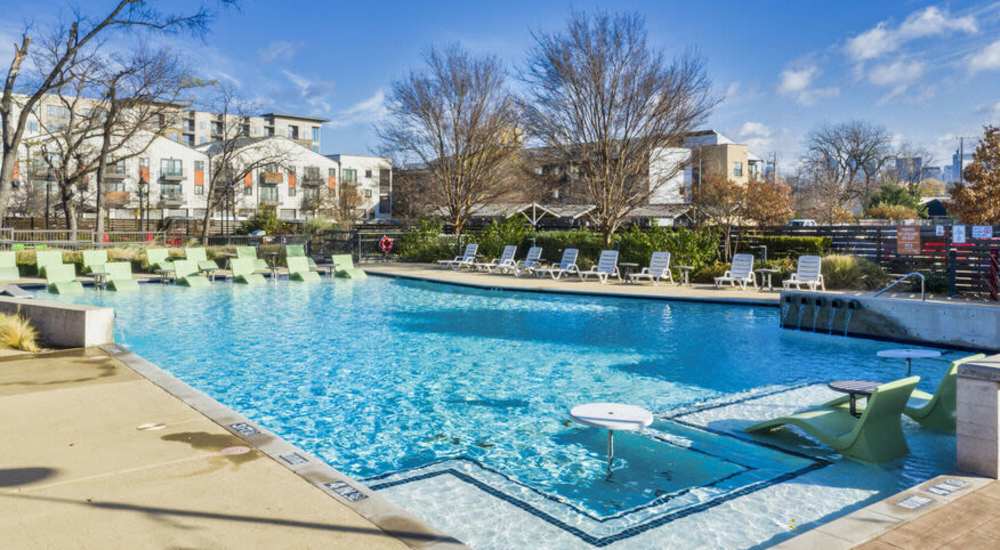 Resort-style swim-up pool at Pike West Commerce in Dallas, Texas