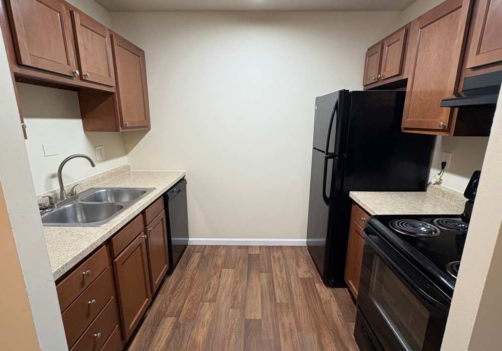 Kitchen with modern appliances at Edgewood Group Apartments in Merrillville, Indiana