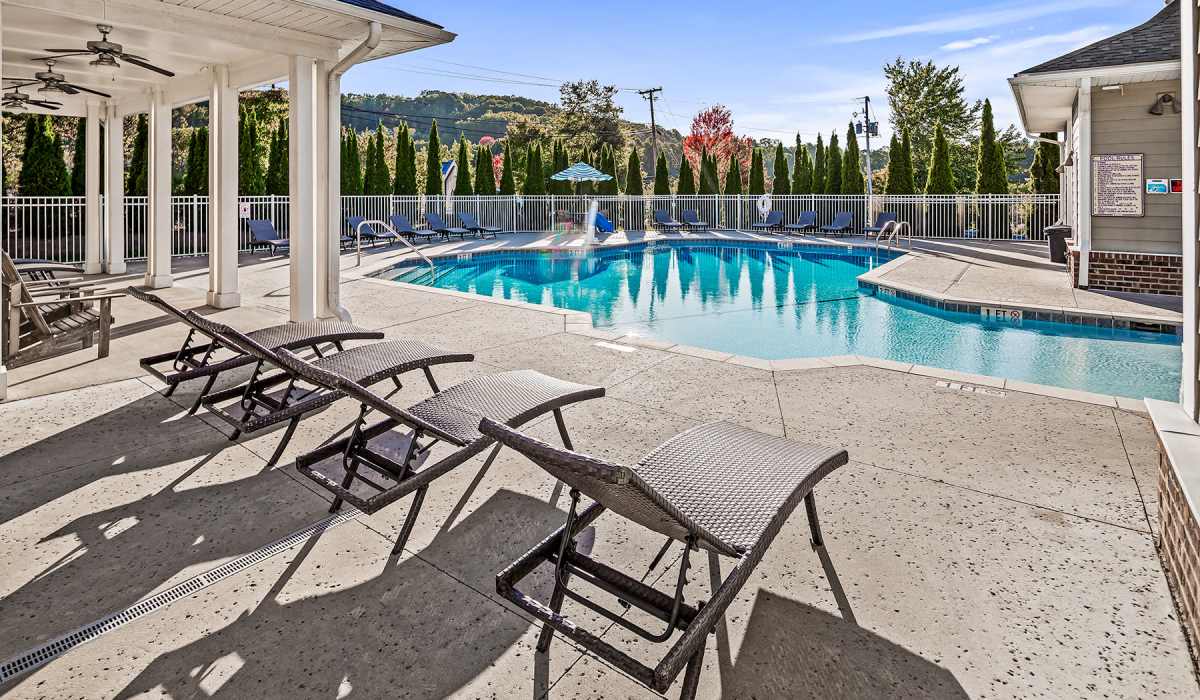 Swimming pool with chairs at Palisades of Asheville in Asheville, North Carolina