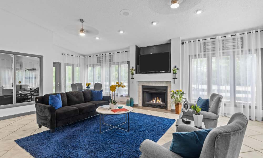 Seating area with fireplace at Cannongate Apartments in Vicksburg, Mississippi