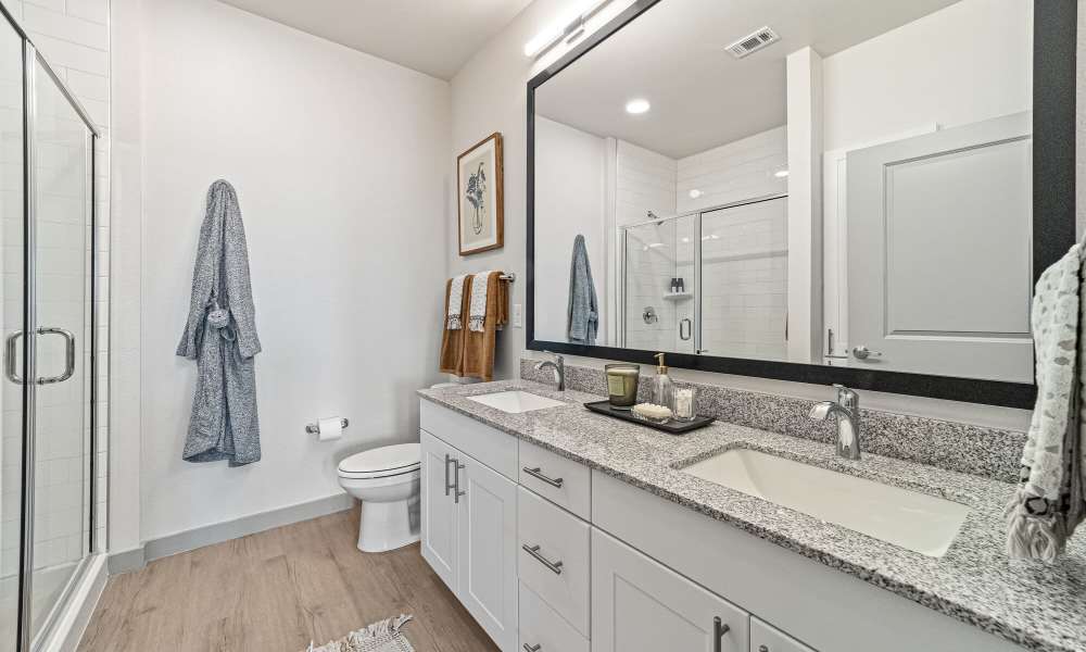 Bathroom with white vanity unit at Main and Mill in Lewisville,Texas
