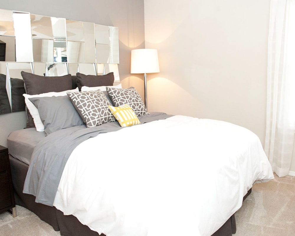 Spacious carpeted bedroom in a model home at Castlegate Collier Hills in Atlanta, Georgia