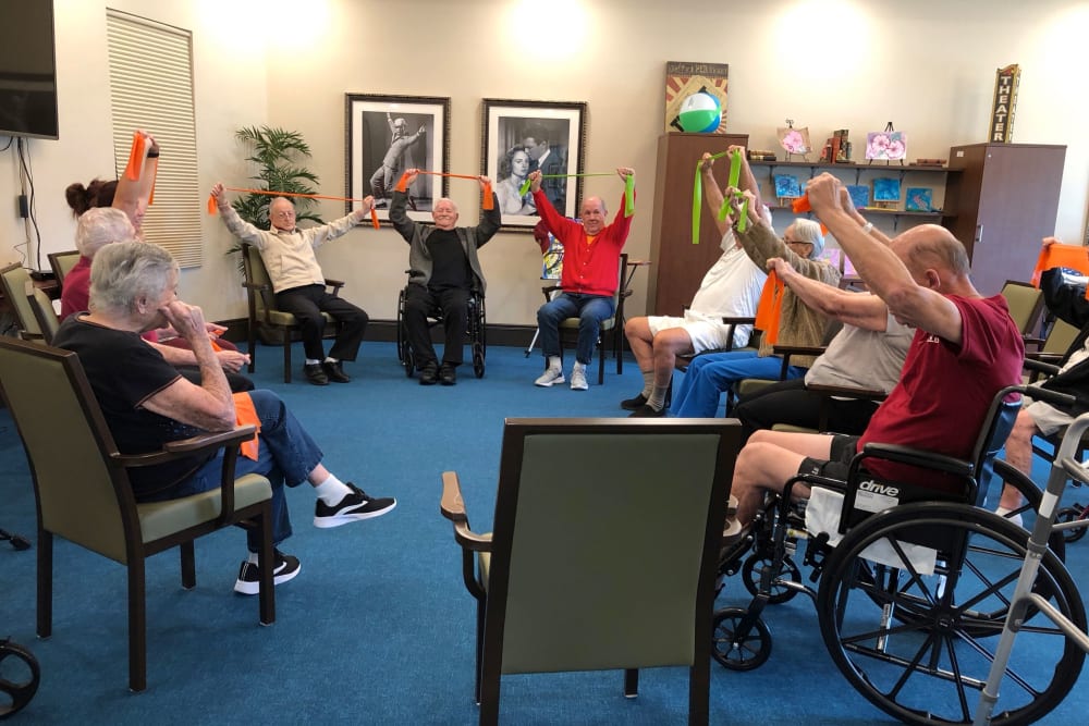 Residents in a wellness class at CERTUS Premier Memory Care Living in Vero Beach, Florida.