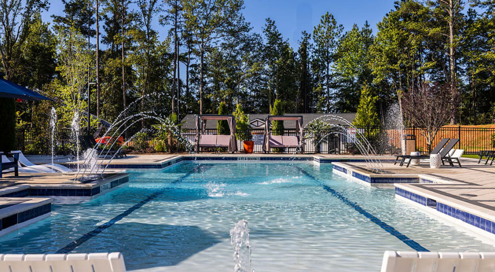 The community swimming pool with water features at Novo Westlake in Jacksonville, Florida