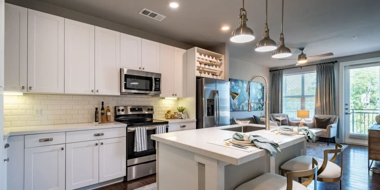 Kitchen with stainless-steel appliances at Luxia Swiss Avenue, Dallas, Texas