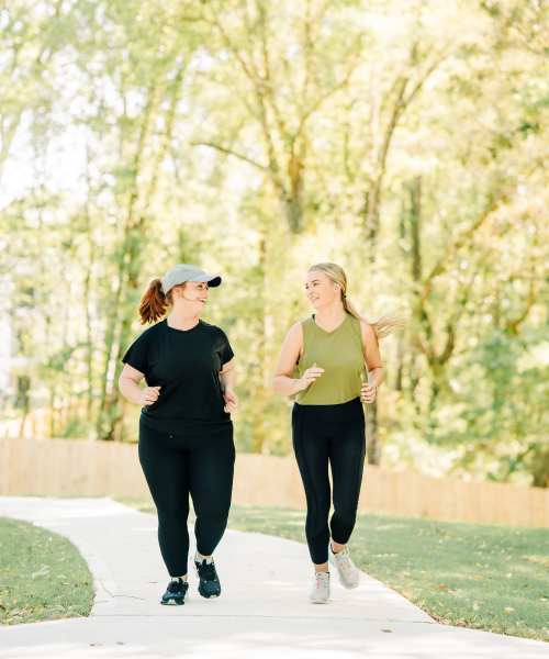 Residents walking along outdoor path at The Flats at Crosspointe in Columbia, South Carolina